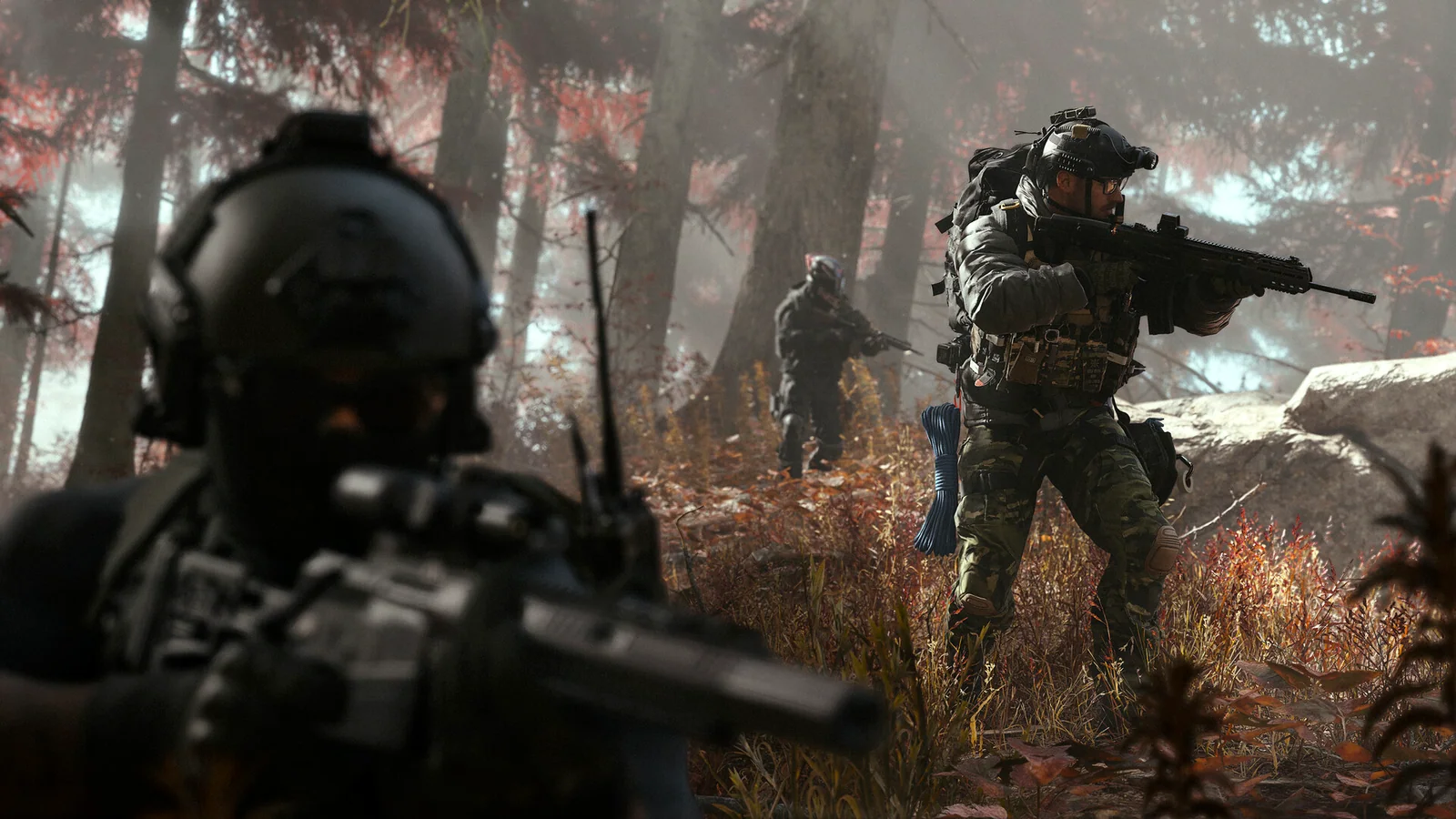 A squad advancing through a smoke-covered forest